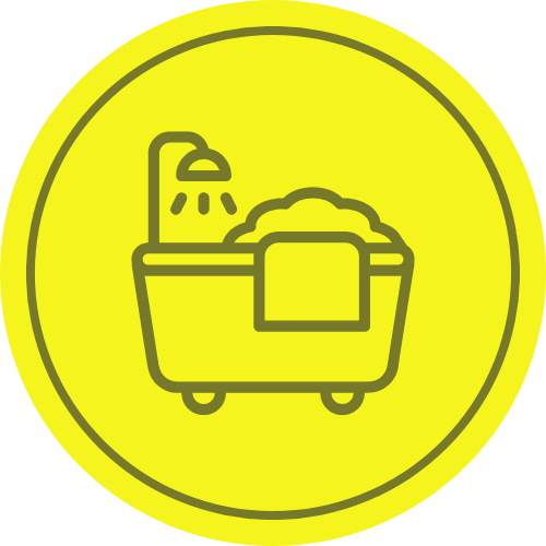 Bathroom icon for spaces we organize. Bathtub with bubbles and towel, shower head, in yellow circle. Clean bathroom organization in New York, NY.