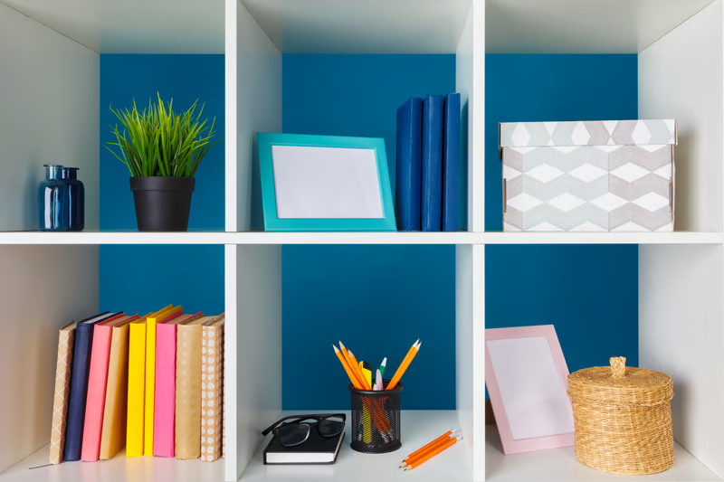 Visible storage shelves with books, boxes, and decorative items for ADHD-friendly organization.