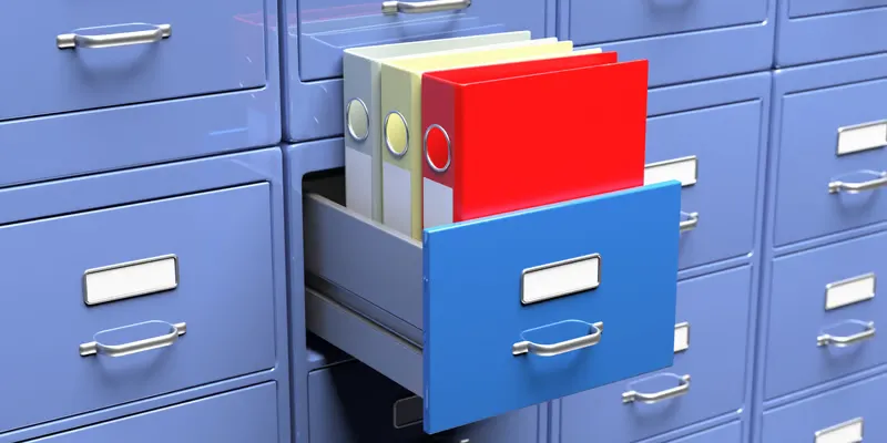 Blue metal file cabinet with an open drawer containing organized colorful folders for improved shared office storage systems